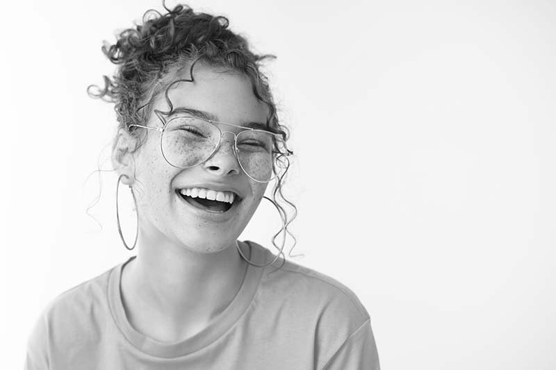 Fair Lakes Cosmetic Dentistry Beautiful Smile Young Girl beautiful girls with freckles smiling openly