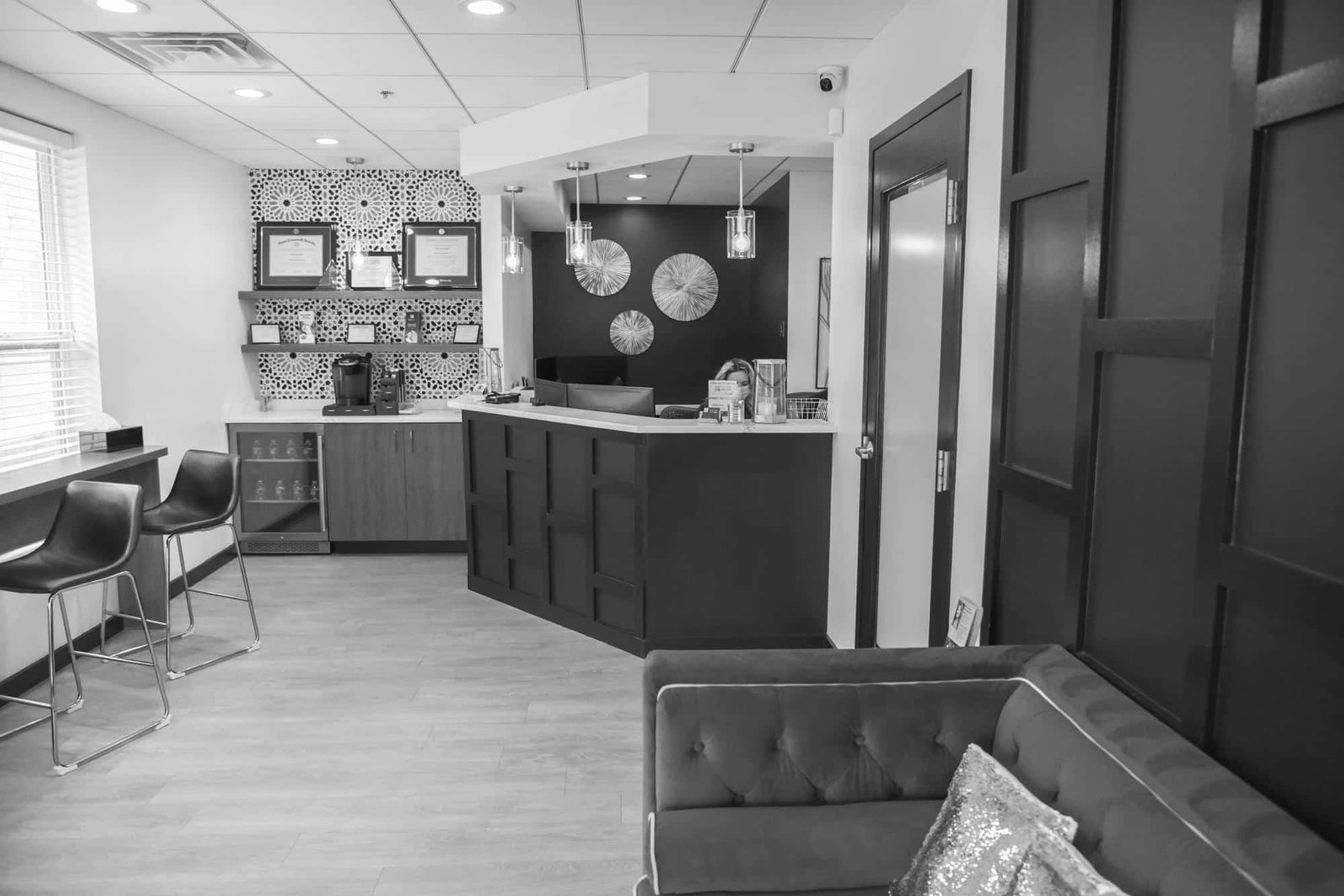 Fair-Lakes-Family-and-Cosmetic-Dentistry-interior-lobby Fair Lakes Family and Cosmetic Dentistry back and white photo of lobby and front desk