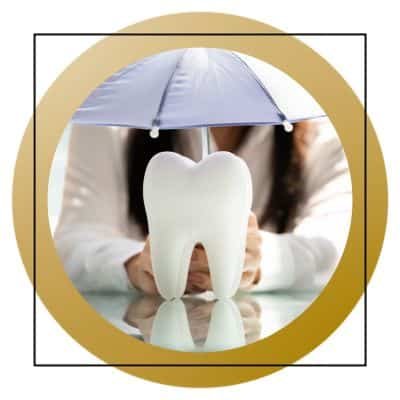 Umbrella over a giant fake tooth