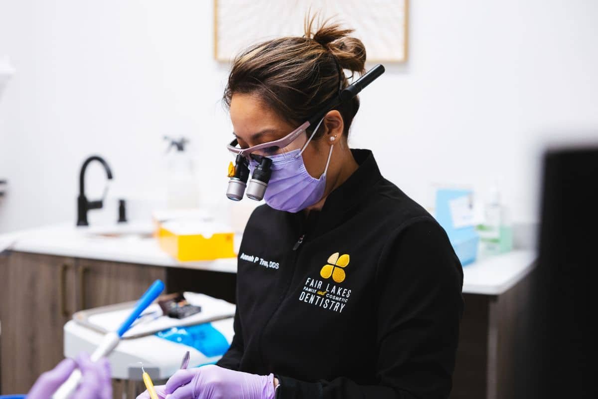 fair-lakes-family-and-cosmetic-dentistry (2) dr tran wearing glasses and purple mask