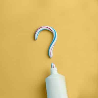 toothpaste arranged to form a question mark